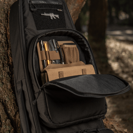 M-Tac Gun Backpack Case 105 cm Elite Hex in the woods, open with compartments for accessories.