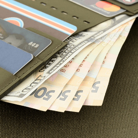 M-Tac Slim Elite with cash and cards in slots, compact and stylish design.
