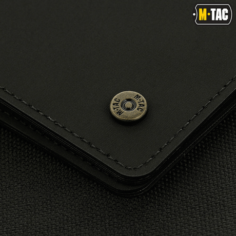 Detail of M-Tac Slim Elite Gen. II with brass stud and modern design, compact and durable in polymer composite.