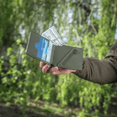 M-Tac Slim Elite Gen. II with dollar bills and cards in exterior pockets.