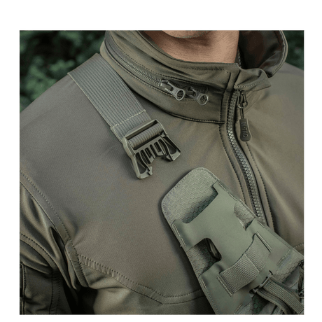 M-Tac Sling Pistol Bag Elite Hex in use with adjustable shoulder strap and buckle, suitable for comfortable concealed carry.