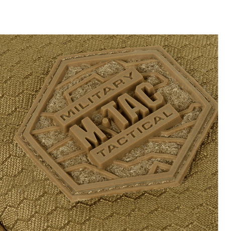 Detail of M-Tac Sling Pistol Bag Elite Hex showing military logo on Cordura fabric.