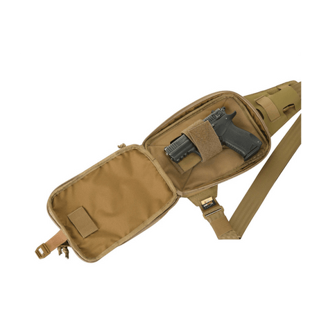 M-Tac Sling Pistol Bag Elite Hex with pistol, adjustable strap and roomy compartments for transport.