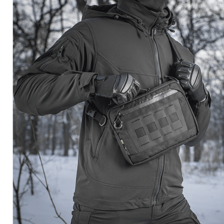 Person with M-Tac Admin Bag Elite in a wintry forest