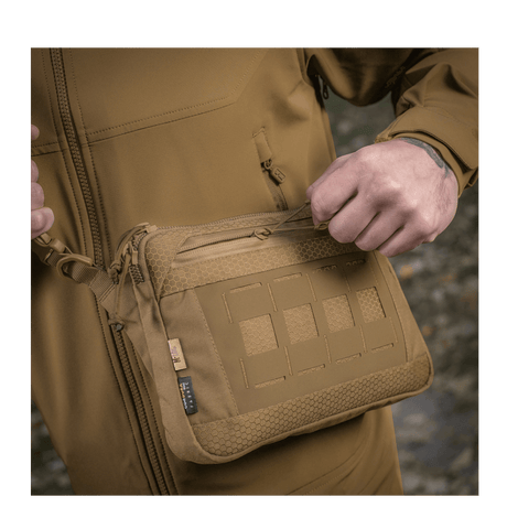 M-Tac Admin Bag Elite in Cordura material with YKK zippers, worn by a person in outdoor surroundings