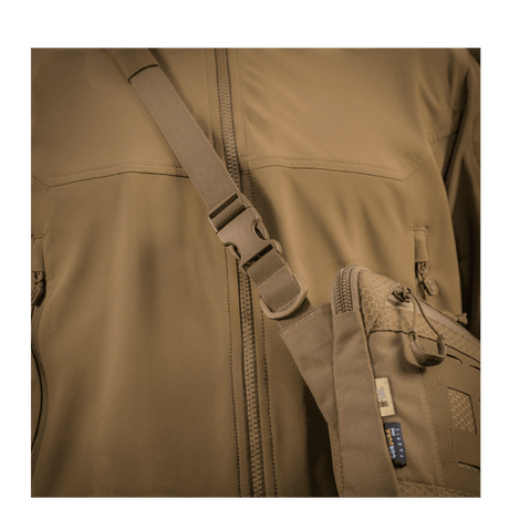 M-Tac Admin Bag Elite on the chest of a person wearing brown clothing with adjustable shoulder strap and Cordura material
