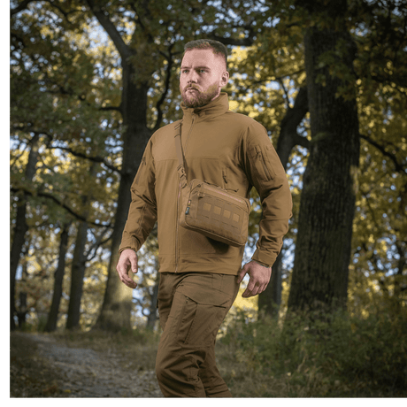 Man with M-Tac Admin Bag Elite in the forest, wearing tactical clothing, adjustable shoulder strap, Cordura, natural background
