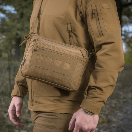 Man wearing M-Tac Admin Bag Elite made from Cordura 500D with adjustable shoulder strap in nature