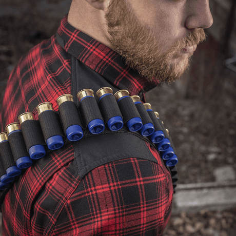 M-Tac Bandolier Elite for hunting, shown on a person wearing a red plaid shirt, 55-shell capacity, ergonomic design, convenient ammunition access.