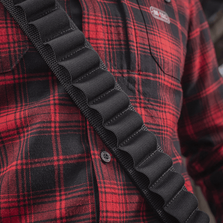 M-Tac Bandolier Elite cartridge bandolier for hunting with double straps, shown on a person in a red plaid shirt. Capacity: 55 shells.