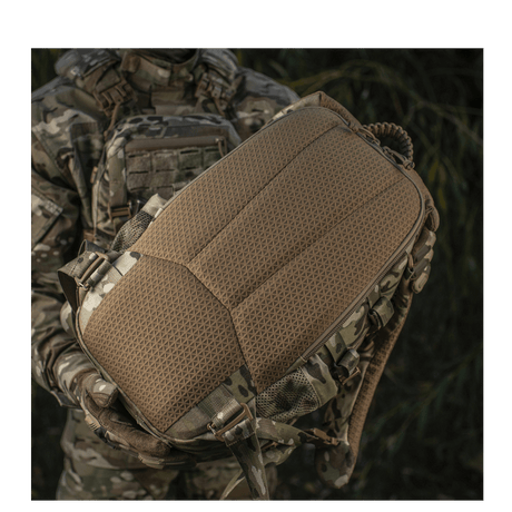Soldier with M-Tac Mission Pack Elite backpack in durable Cordura 1000D with MOLLE LASER CUT system for expanding volume.