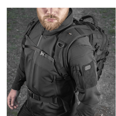 Man wearing M-Tac Mission Pack Elite backpack with ergonomic design and Cordura 1000D, equipped with MOLLE LASER CUT system.
