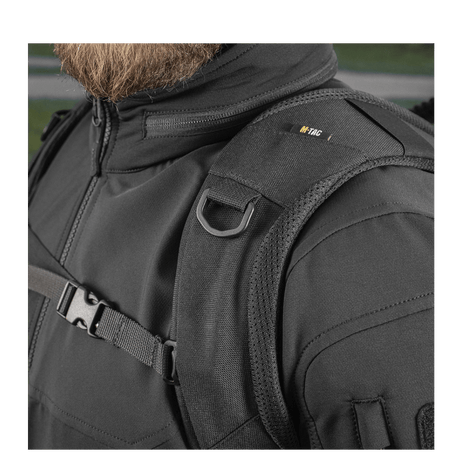 Close-up of M-Tac Mission Pack Elite backpack with ergonomic design, black Cordura 1000D, and MOLLE LASER CUT system.