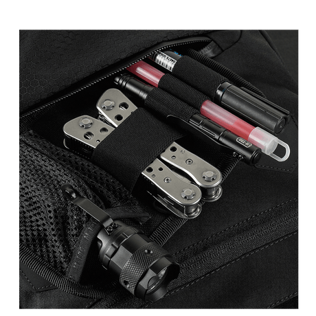 Close-up of M-Tac Konvert Taske Elite pockets with tools and implements; the bag is made of durable Cordura material.