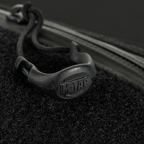 Close-up of YKK zipper on M‑Tac Belt Bag Elite Hex showing the brand logo on a black background.