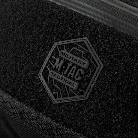 Close-up of M‑Tac Belt Bag Elite Hex showing logo and black Cordura fabric with Woojin buckles and waterproof YKK zipper.