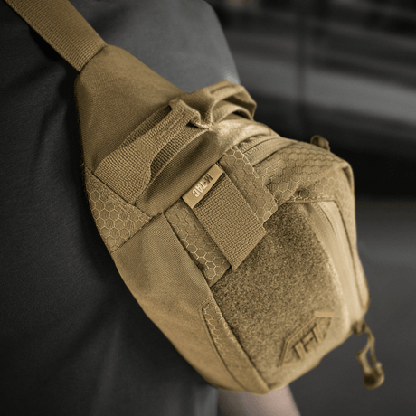 M‑Tac Belt Bag Elite Hex in use, showing stylish design and functional compartments made of Cordura fabric with YKK zippers.