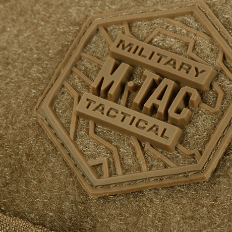 Close-up of M‑Tac Belt Bag Elite Hex with brown tactical logo on textured material.