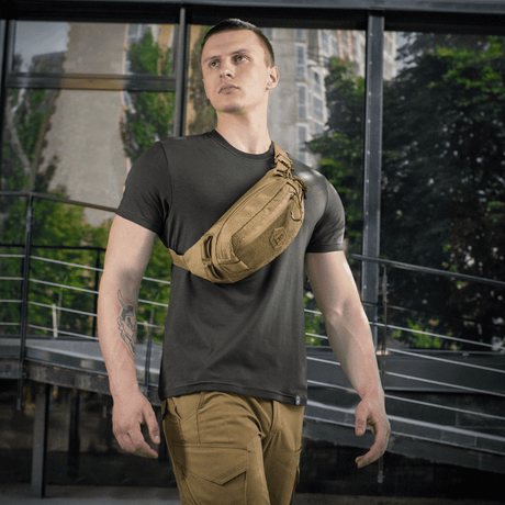 Man with M‑Tac Belt Bag Elite Hex in Cordura, perfect for everyday use or tactical gear. Elegance meets functionality.
