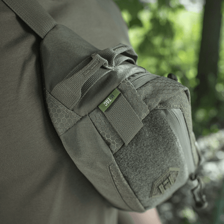 M‑Tac Belt Bag Elite Hex in Cordura 500D, shown on person. Compact bag for everyday use, with waterproof zipper and Velcro panel.