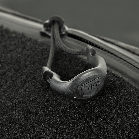 Close-up of M‑Tac Elite Hex belt bag with zipper and logo, detailed stitching on stylish design.