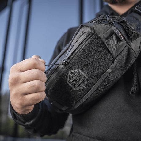 M-Tac Elite Hex belt bag in use, showing durable design in Cordura fabric with YKK zipper and Woojin buckles, perfect for everyday use.