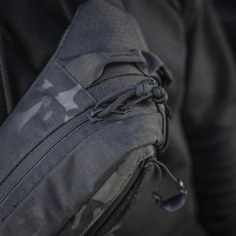 Close-up of M‑Tac Elite Hex belt bag with Cordura material and YKK zippers, stylish design, ideal for tactical use.