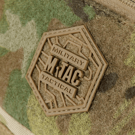 M‑Tac Elite Hex belt bag logo on a camouflage Cordura design, close view of the tactile badge on the bag.