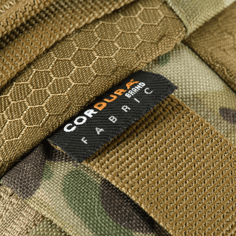 Close-up of Cordura fabric label on M‑Tac Elite Hex belt bag, showing the robust and stylish design of the bag.