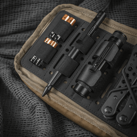 M-Tac Module Insert Molle 11x19, Laser Cut in use organizing gear in a backpack, with laser-cut compartments for EDC equipment.