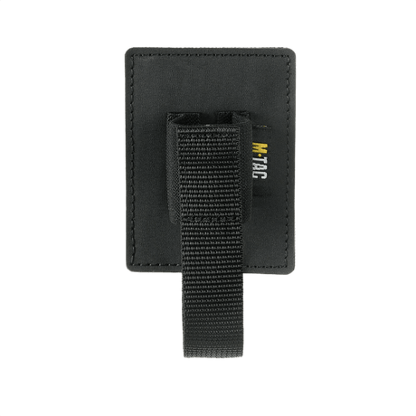 M-Tac modular insert for pepper spray in black polymer composite with elastic strap for secure attachment and quick access.