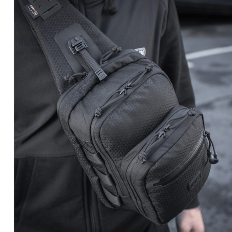 Man wearing M-Tac Cross Bag Slim Elite Hex in black on the shoulder.