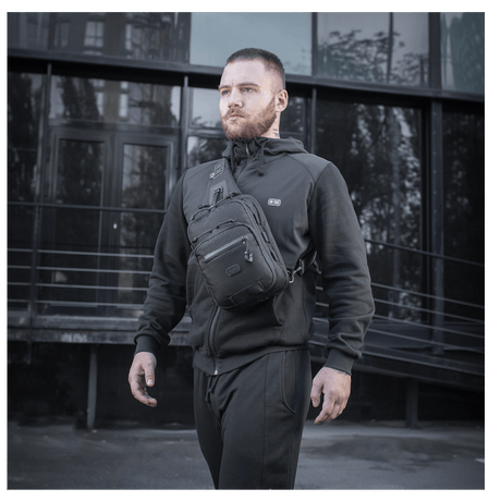 Man wearing M-Tac Cross Bag Slim Elite Hex, a stylish and functional bag made of Cordura with YKK and Woojin fittings.