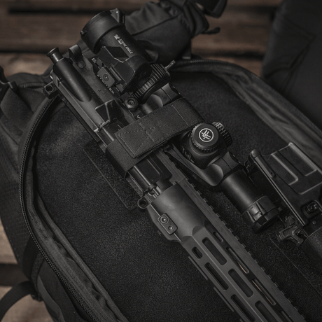 M‑Tac Backpack Inserts (3 pcs) with weapon accessories on a Velcro panel in a tactical backpack.