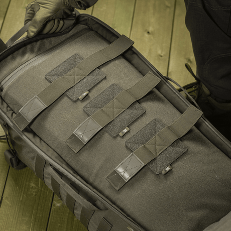 M‑Tac Backpack Inserts (3 pcs) secure weapons in cases and M‑Tac Large Elite Hex backpack with Velcro panel for optimal security.