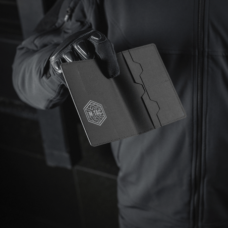 M‑Tac passport cover in black polymer with stylish logo that protects passport from wear. Practical for travel, fits Ukrainian and foreign passports.