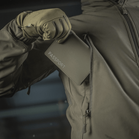 M‑Tac passport cover in a jacket, protects passport from damage, modern polymer, practical travel accessory, passport sleeve.