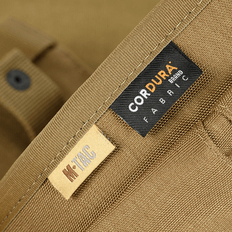 Close-up of M‑Tac Magazine Dump Pouch Lite Elite in Cordura 500D fabric with visible markings that emphasize strong material.