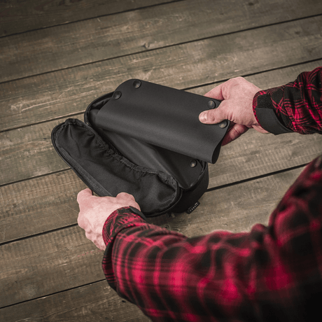 M‑Tac Field Maintenance Tray 18x30 cm foldable maintenance tray in black polymer on a wooden table.