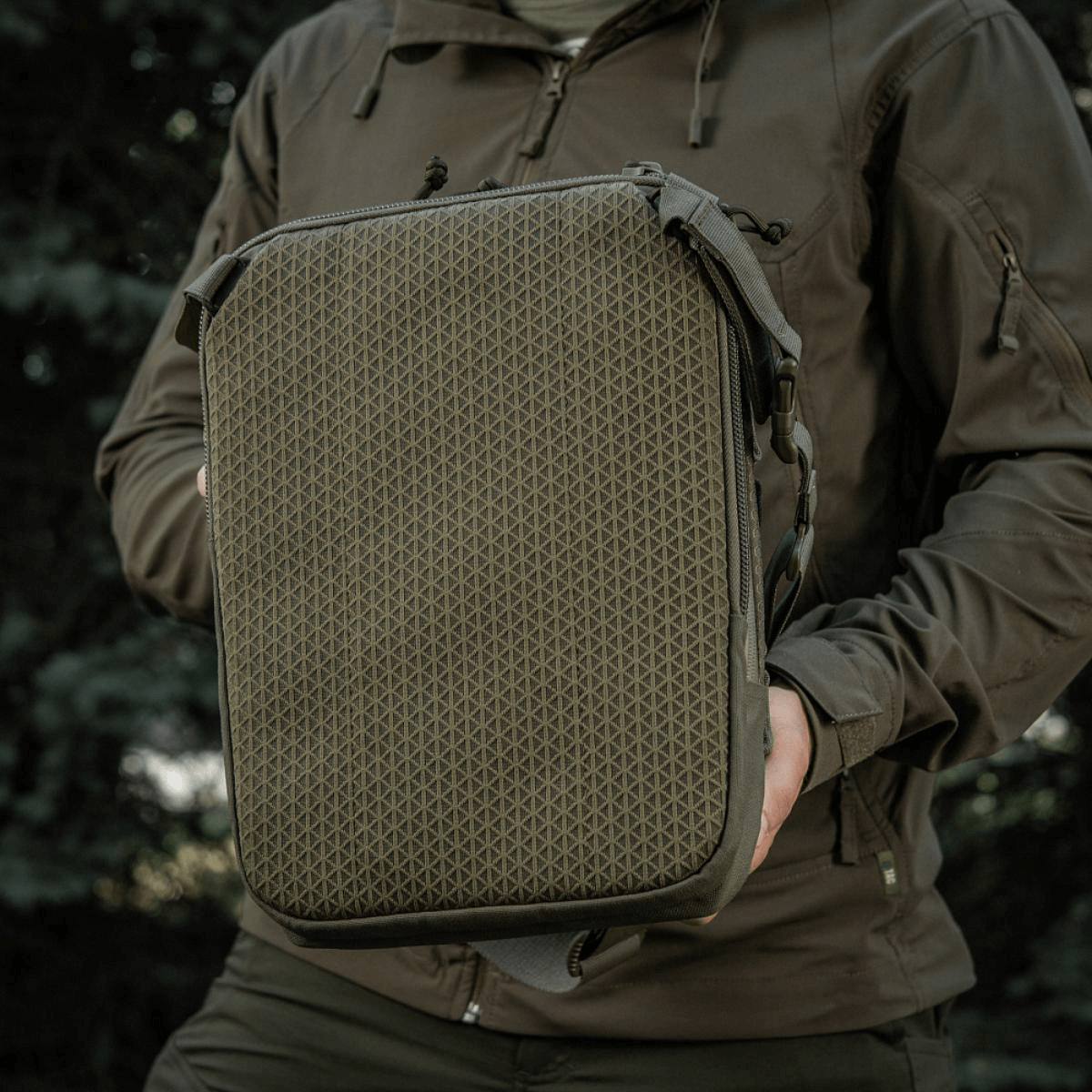 M-Tac Tablet Bag Laser Cut Hex in Cordura with Laser Cut MOLLE, shown in outdoor setting.