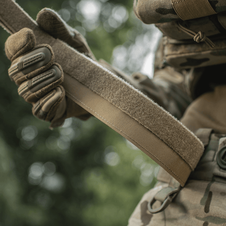 M-Tac Internal Tiger Belt held by a tactically dressed person, suitable for military and tactical use
