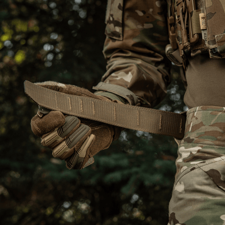 M-Tac Cobra Buckle Tactical Belt Laser Cut in use during outdoor activity, suitable for military and police with MOLLE interface.