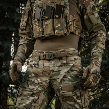 M-Tac Cobra Buckle Tactical Belt Laser Cut on a military uniform in the forest.
