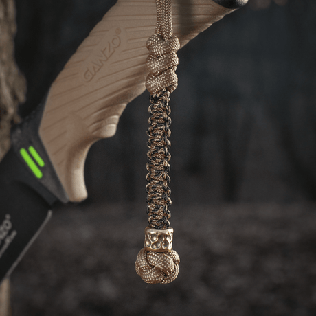 M-Tac Knife Lanyard Scandinavian Granule in braided paracord on a knife, stylish accessory and practical extension of the knife handle.