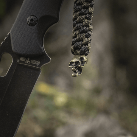 M-Tac Knife Lanyard Helix Skull braided paracord decorated with a skull, adds style and functionality to your pocket knife.
