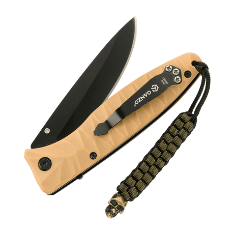 M-Tac Knife Lanyard Cuboid Skull on a brown pocket knife with paracord and decorative Cuboid Skull bead for a unique look.