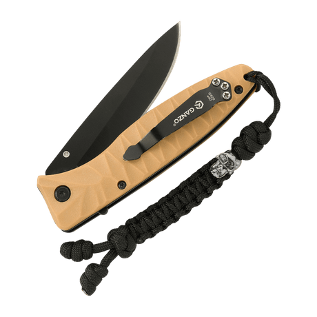 M-Tac Loopy Snake Skull Lanyard on a knife, made of braided paracord, for decorative and practical use with gear.