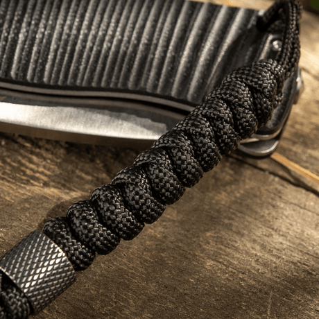 M-Tac Viper Lanyard Stainless Steel with braided paracord and stainless steel bead, adds function and style to the knife.