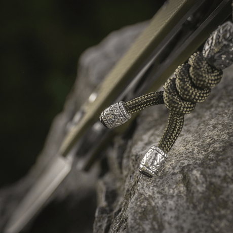 M-Tac Zeus Stainless Steel Lanyard in braided paracord design with decorative beads for quick knife access and gear security.