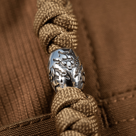 M-Tac Zeus Stainless Steel Lanyard with braided paracord and decorative bead, ideal for quick access to knife and gear.